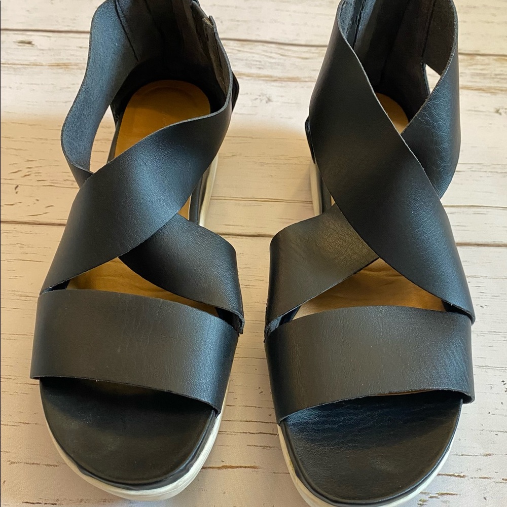 Black leather gladiator sandals